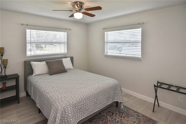 bedroom featuring ceiling fan and hardwood / wood-style flooring