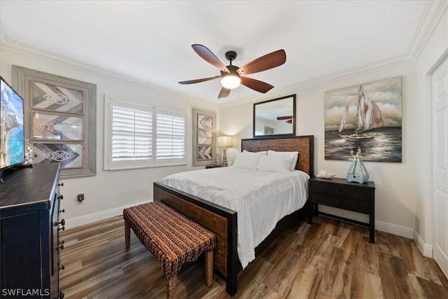 bedroom with ceiling fan, crown molding, and dark wood-type flooring