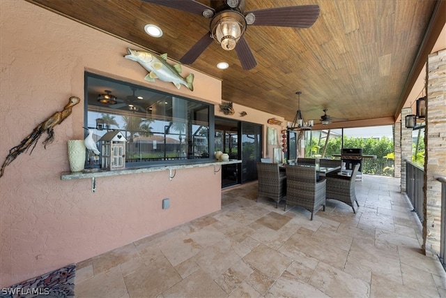 view of terrace with area for grilling and ceiling fan