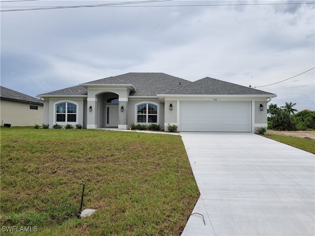 single story home with a front yard and a garage