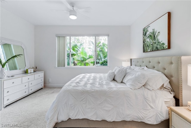 bedroom featuring ceiling fan and light colored carpet