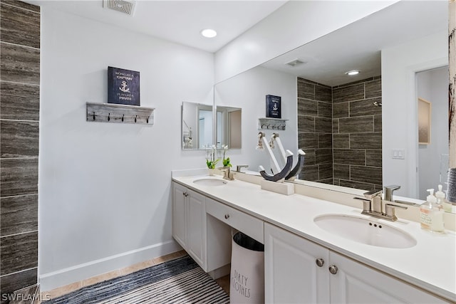 bathroom with dual sinks and large vanity