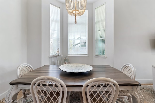 dining space with a notable chandelier and a wealth of natural light