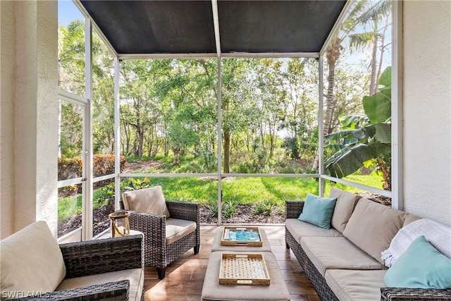 sunroom / solarium featuring outdoor lounge area