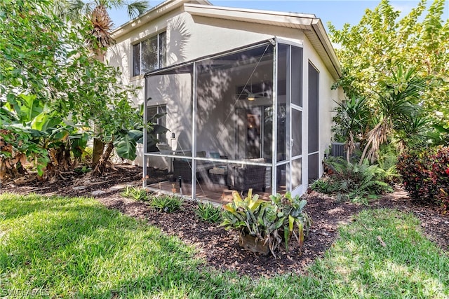view of outdoor structure with a sunroom