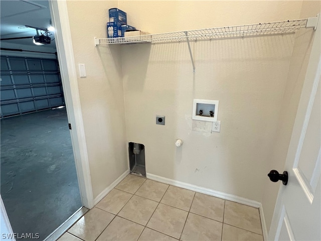 laundry room with hookup for a washing machine, hookup for an electric dryer, hookup for a gas dryer, and light tile floors