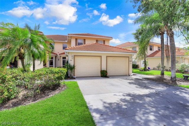 mediterranean / spanish-style home with a garage and a front yard