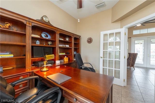 tiled home office featuring french doors and ceiling fan