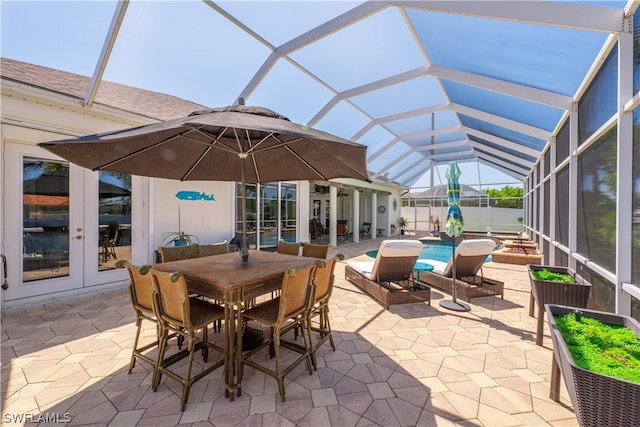 sunroom featuring french doors