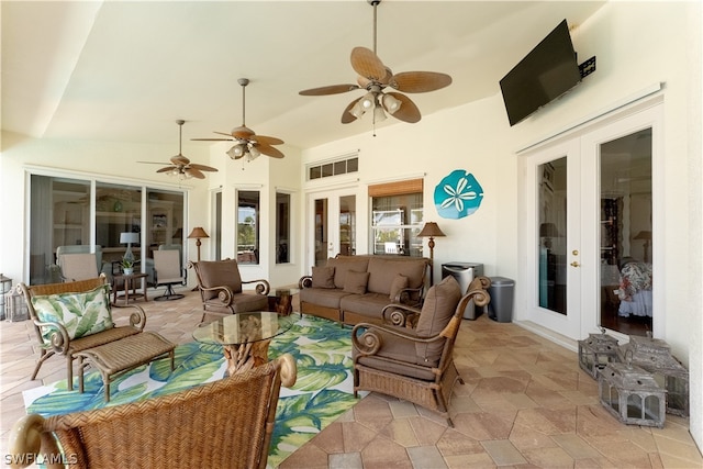 view of patio / terrace featuring french doors, an outdoor living space, and ceiling fan