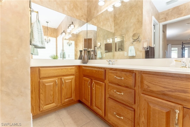 bathroom featuring double vanity and tile floors