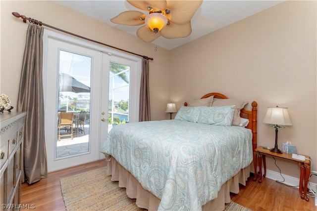 bedroom with french doors, ceiling fan, access to exterior, and light hardwood / wood-style flooring