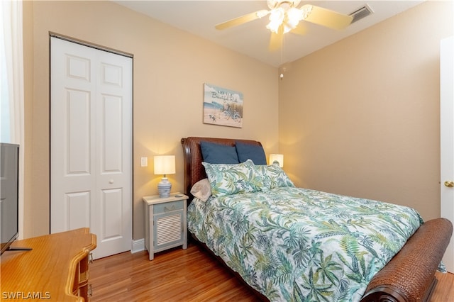 bedroom featuring a closet, ceiling fan, and light wood-type flooring