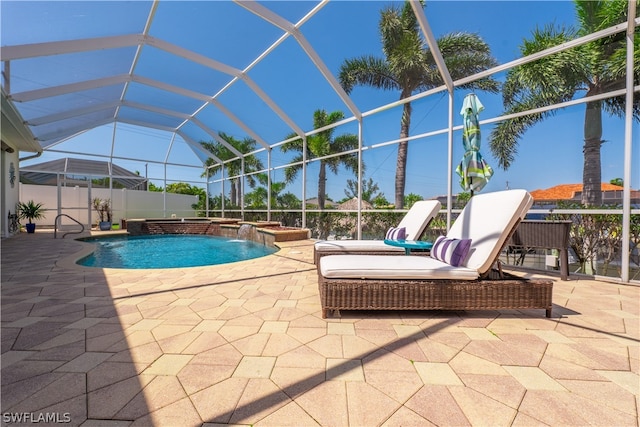 view of swimming pool featuring a patio area, pool water feature, a jacuzzi, and a lanai