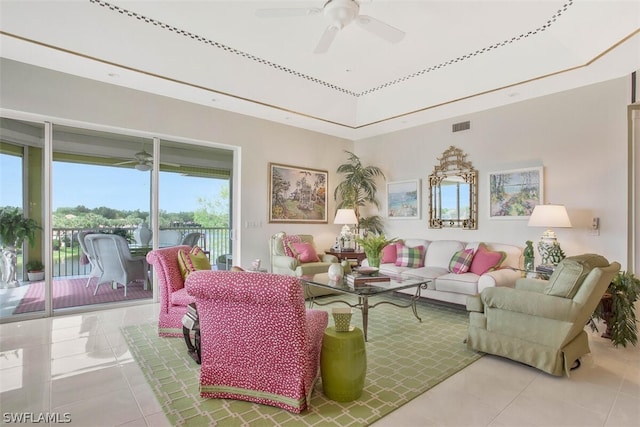 tiled living room with ceiling fan