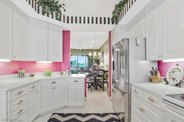 kitchen with white cabinetry, hanging light fixtures, kitchen peninsula, and light tile patterned flooring