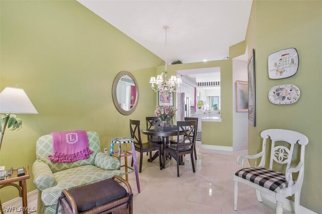 dining space with a notable chandelier, vaulted ceiling, and light tile patterned floors