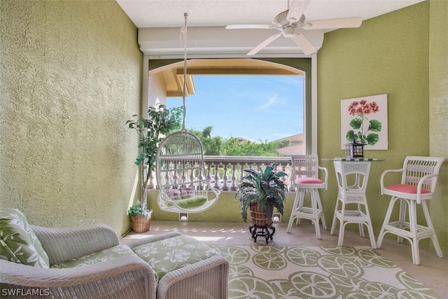 balcony featuring ceiling fan