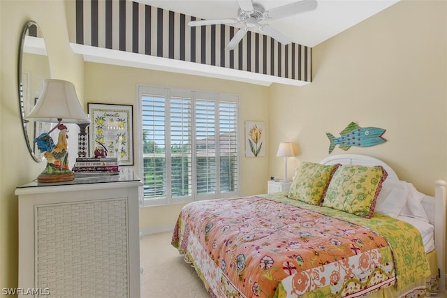 bedroom featuring ceiling fan and light colored carpet