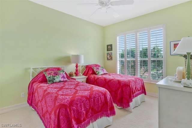 carpeted bedroom featuring multiple windows and ceiling fan