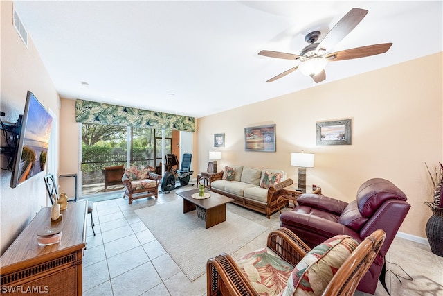 tiled living room featuring ceiling fan