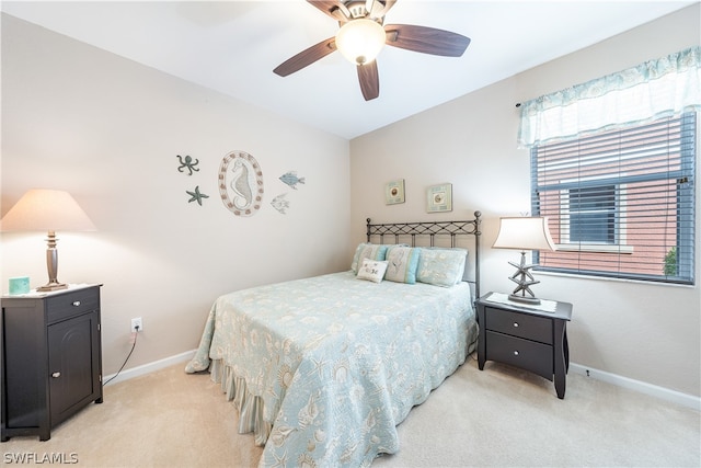 bedroom with light carpet and ceiling fan