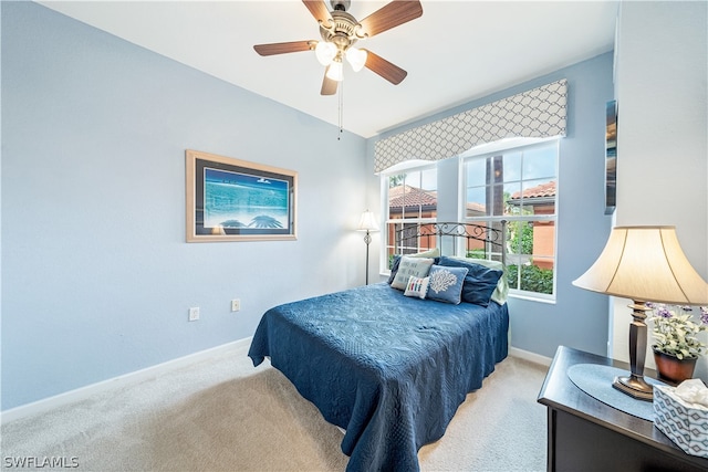 bedroom featuring ceiling fan and light colored carpet