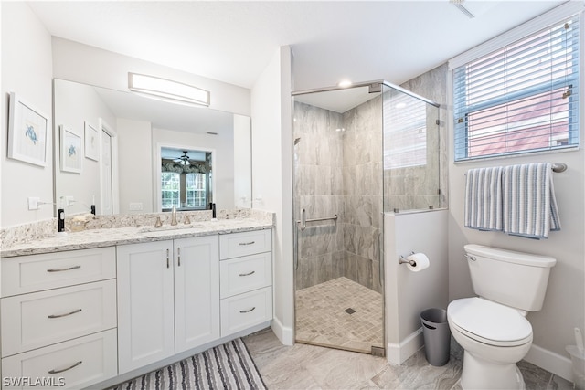 bathroom featuring toilet, tile flooring, a tile shower, and vanity