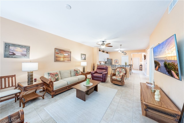 tiled living room with ceiling fan