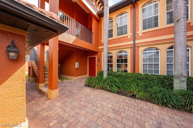 entrance to property with a patio