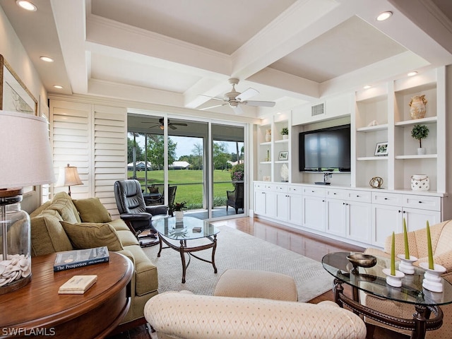 living room with coffered ceiling, crown molding, wood-type flooring, ceiling fan, and beam ceiling