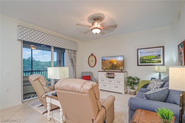 tiled living room with ornamental molding and ceiling fan