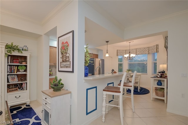 hallway featuring light tile floors, a chandelier, and crown molding