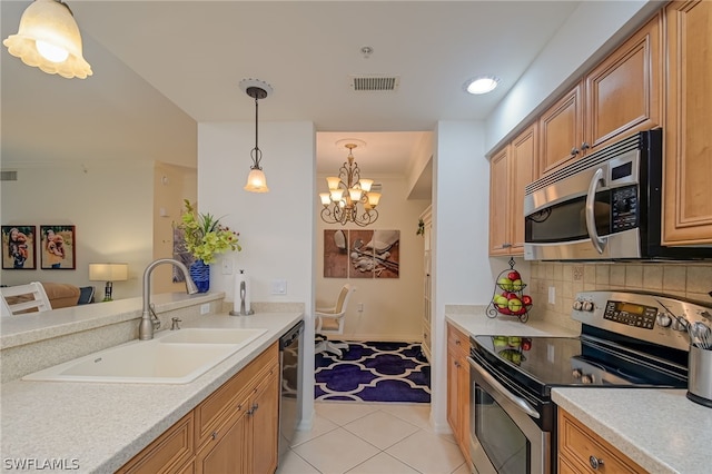 kitchen featuring hanging light fixtures, appliances with stainless steel finishes, backsplash, light tile flooring, and an inviting chandelier