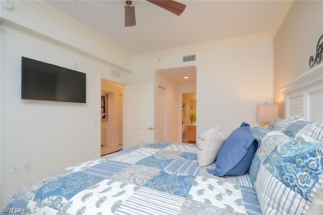 bedroom with ensuite bath, crown molding, and ceiling fan