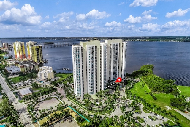 birds eye view of property with a water view