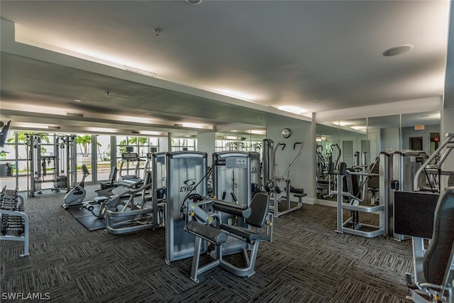 workout area featuring dark carpet