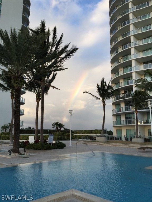 view of pool at dusk