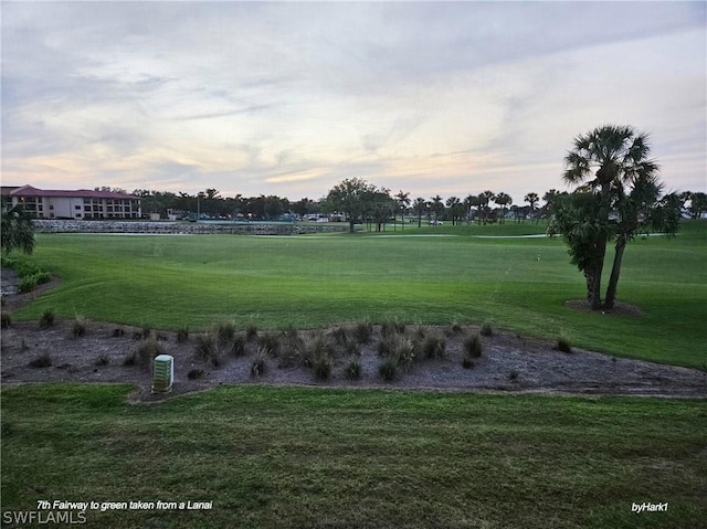 surrounding community featuring a lawn