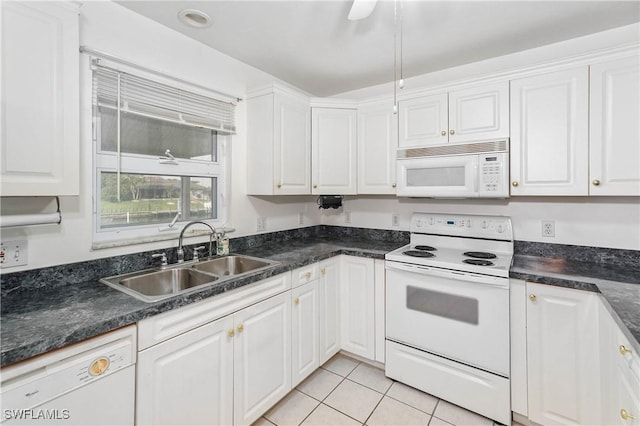 kitchen with white cabinetry, sink, light tile patterned floors, and white appliances