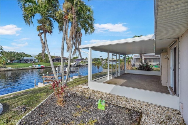 view of patio featuring a boat dock and a water view