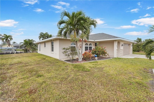 single story home featuring a front lawn and a garage