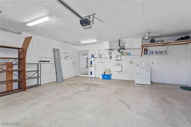 garage with electric water heater, sink, a garage door opener, and washer / dryer