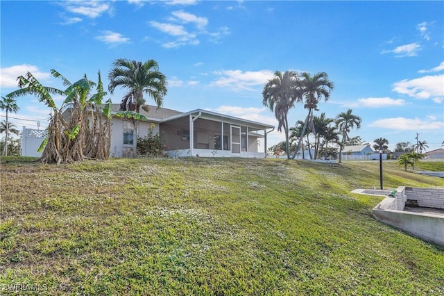 view of yard with a sunroom