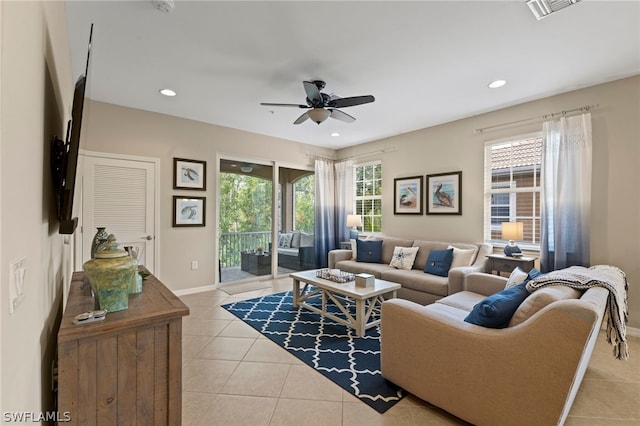 tiled living room featuring ceiling fan