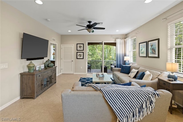 tiled living room with ceiling fan