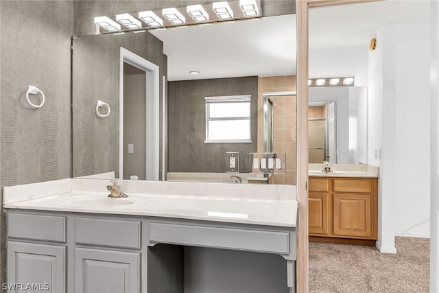 bathroom with vanity with extensive cabinet space and dual sinks