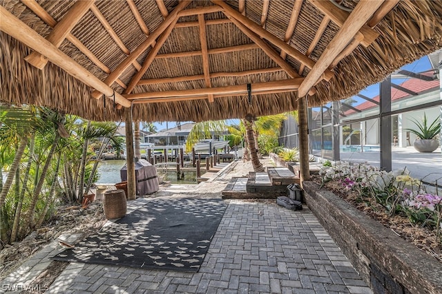 view of patio featuring a lanai