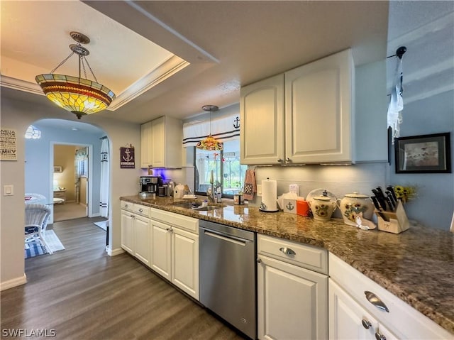 kitchen with white cabinets, stainless steel dishwasher, hanging light fixtures, and dark wood-type flooring