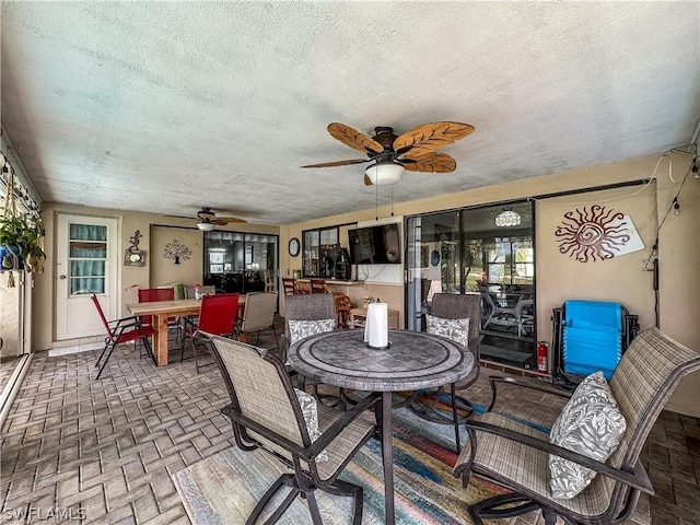 sunroom / solarium with ceiling fan